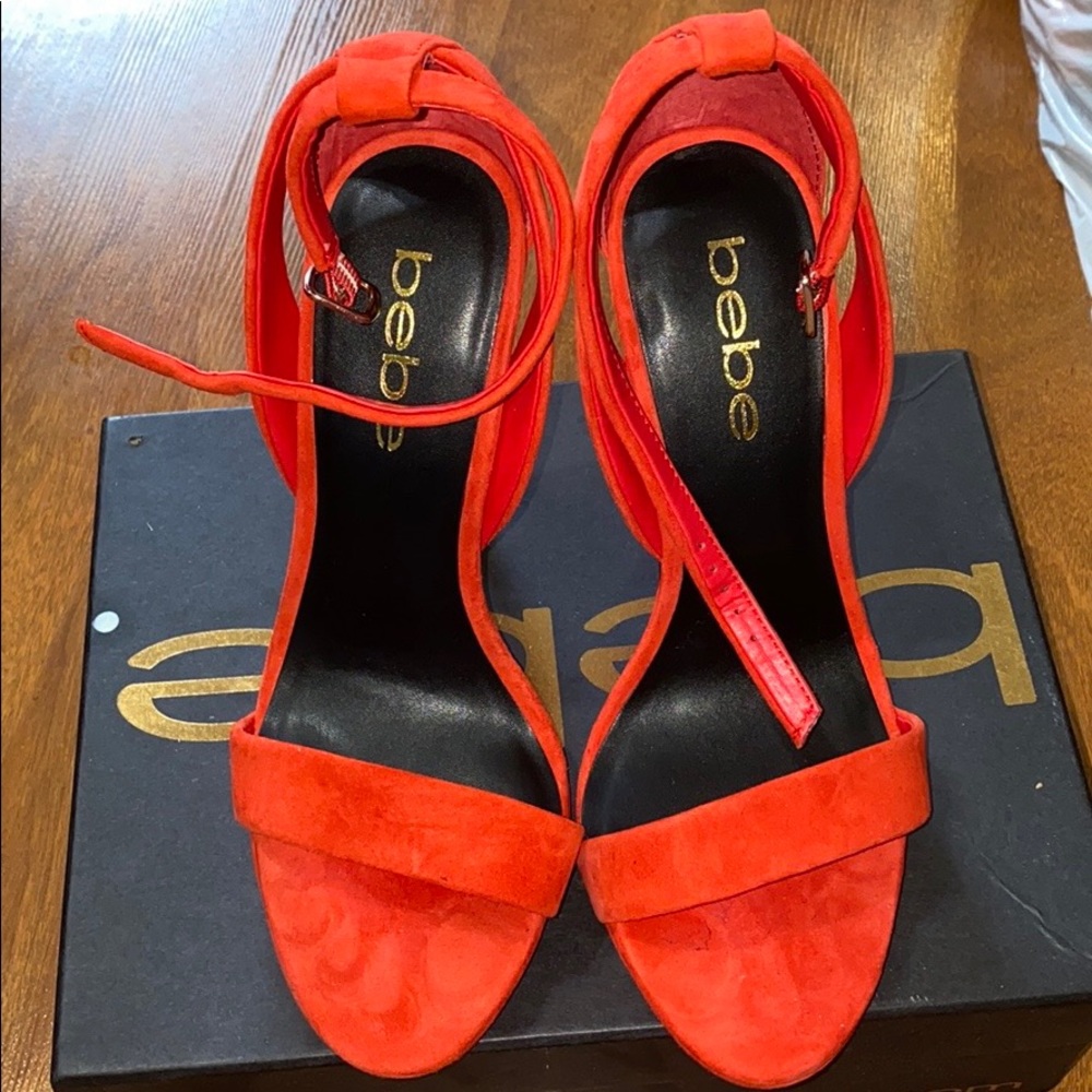 Brand new orange bebe heels.